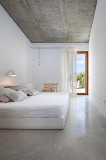 Spacious and bright white bedroom