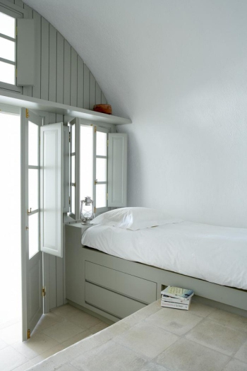 Spacious and bright white bedroom