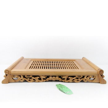 Dual bamboo tea tray filled with water drainage